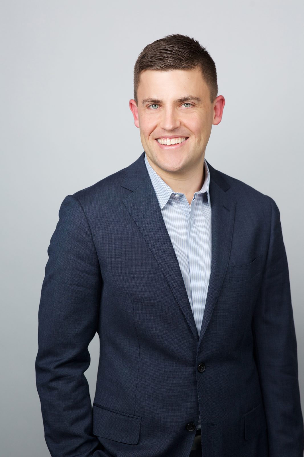 ERAS headshot — man in a navy suit, Times Square studio, New York